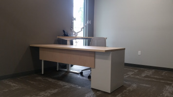 Private office with single desk and chair.