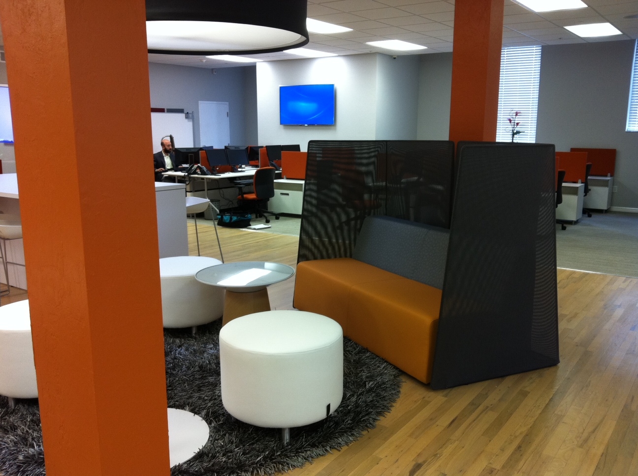 Lagunitas lounge system in black and orange with white ottomans and a brown turnstone campfire table.